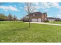Spacious home with a large yard and three-car garage at 519 Southwind, Brownsburg, IN 46112