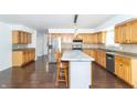 Well-lit kitchen featuring stainless steel appliances, center island, and ample cabinetry at 7372 Deerfield Dr, Greenfield, IN 46140