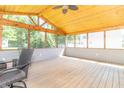Cozy screened-in porch with wood flooring and ceiling, perfect for relaxing at 7372 Deerfield Dr, Greenfield, IN 46140