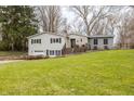 Charming home featuring a well-manicured lawn and inviting front porch at 7806 Meadowbrook Dr, Indianapolis, IN 46240