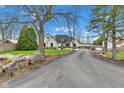 Charming two-story home with beautifully landscaped front yard and long driveway at 8146 W 875 S, Pendleton, IN 46064