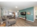 Spacious living room featuring hardwood floors and modern decor at 10946 Snowdrop Way, Indianapolis, IN 46235