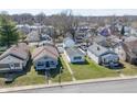 Neighborhood aerial view showcasing the homes, mature trees, and the surrounding community at 1135 E Southern Ave, Indianapolis, IN 46203