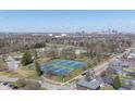 Scenic aerial view of the community featuring a park with tennis courts and downtown skyline views at 1135 E Southern Ave, Indianapolis, IN 46203