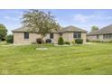 Expansive backyard of the brick home, perfect for outdoor activities and relaxation at 1864 Holiday Pines Dr, Brownsburg, IN 46112
