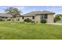 Spacious backyard featuring lush greenery and a well-maintained lawn at 1864 Holiday Pines Dr, Brownsburg, IN 46112