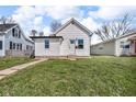 Attractive single-story home with a green lawn, new windows, and inviting curb appeal at 1924 S A St, Elwood, IN 46036