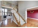 Beautiful stairway with wood and carpeted treads with views to the living room and the formal dining room at 2009 W 250 N, Lebanon, IN 46052