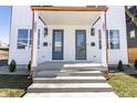 Charming covered front porch with stone steps, perfect for relaxing outdoors at 2051 Columbia Ave, Indianapolis, IN 46202