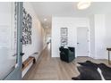 Hallway featuring a long view of the home, leading to a cozy seating area with art at 2051 Columbia Ave, Indianapolis, IN 46202