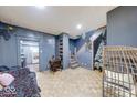 Living room showcasing built-in shelves, staircase, and a view into the kitchen at 215 S Warman Ave, Indianapolis, IN 46222