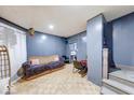 Cozy living room with neutral walls and wood-look floors at 215 S Warman Ave, Indianapolis, IN 46222