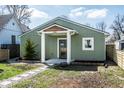 Charming home featuring new landscaping, sidewalk, and a covered entryway at 2361 Southeastern Ave, Indianapolis, IN 46201
