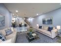 Spacious living room featuring modern furniture, hardwood floors, and contemporary decor at 256 Strand Ln # Apt C, Avon, IN 46123