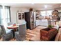 Inviting dining area with seating for four and stainless steel appliances in the background at 316 Laurel St, Pendleton, IN 46064