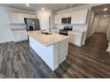 Modern kitchen with a large center island, stainless steel appliances, and white cabinetry at 3181 W Keepsake Ln, Monrovia, IN 46157