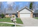 Inviting single-Gathering home with a well-kept lawn, attached garage, and traditional mailbox near the front at 3334 Eden Village Pl, Carmel, IN 46033