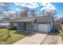 Charming ranch-style home featuring a covered front porch and an attached single-car garage at 4429 Tucson Dr, Indianapolis, IN 46241