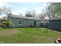 A spacious backyard with an old shed and a grassy yard perfect for outdoor activities at 4502 W 36Th St, Indianapolis, IN 46222