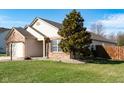 This cozy home showcases a well-kept lawn, complemented by charming brick and siding details at 5846 Edgewood Trace Blvd, Indianapolis, IN 46239