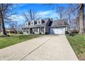 Beautiful two story home featuring a long driveway with basketball hoop at 6820 W Forest Brook Dr, Fountaintown, IN 46130