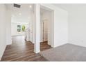 Entryway showcasing hardwood floors that lead into a bright and airy living space at 8726 Hollander Dr, Camby, IN 46113