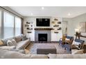 Bright living room features built-in shelving, fireplace, plush seating, and contemporary decor at 950 Edmonds Pl, Greenwood, IN 46143