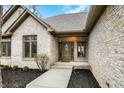 Elegant brick entryway featuring a stylish front door and manicured landscaping at 12618 E 86Th St, Indianapolis, IN 46236