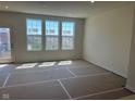 Bright living room area featuring large windows that flood the space with natural light at 14539 Hanford Ln, Carmel, IN 46032