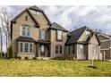 Lovely brick home with a manicured lawn, featuring multiple windows and a covered entrance at 14818 Autumn View Way, Fishers, IN 46037