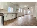 Bright kitchen with white cabinets, wood countertops, stainless steel appliances, and wood floor at 1518 Lawton Ave, Indianapolis, IN 46203