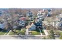 Aerial view of the home showcasing its location within a residential neighborhood with mature trees at 1521 Pleasant St, Indianapolis, IN 46203