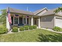 Inviting front porch with decorative patriotic banners and seating, offering a warm welcome at 3002 Branch St, Whiteland, IN 46184