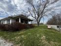 Inviting home with a classic front porch, situated on a spacious lot with mature trees and easy street access at 3179 W 400 N, Fairland, IN 46126