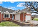 A beautiful red brick home with a two-car garage and well-maintained landscaping at 3447 Heathcliff Ct, Westfield, IN 46074