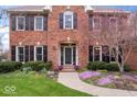 Beautiful brick home featuring meticulously maintained landscaping and a charming walkway to the front door at 3976 Bent Tree Ln, Greenwood, IN 46143