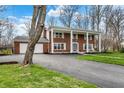Beautiful brick home featuring a long driveway and well-maintained lawn at 40 Twinshore Ct, Carmel, IN 46033