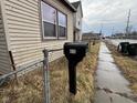 A mailbox with the numbers '413' sits on the sidewalk in front of the home at 413 W 8Th St, Muncie, IN 47302