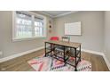 Cozy office space featuring natural light, a modern desk, and hardwood flooring at 4915 E 79Th St, Indianapolis, IN 46250