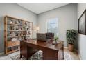 Inviting office with wood desk, shelving, and a cozy rug, perfect for a productive work environment at 5150 Bramwell Ln, Whitestown, IN 46075