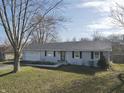 Charming one-story home featuring a two-car garage, well-kept lawn, and neutral colored siding at 589 S 100 W, Franklin, IN 46131