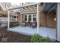 Cozy patio area with a pergola, ideal for enjoying outdoor living and entertaining at 5925 Guilford Ave, Indianapolis, IN 46220