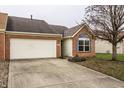 Charming single-Gathering home featuring a brick facade, attached garage and well-maintained landscaping at 6145 Crystal View Dr, Indianapolis, IN 46237
