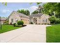 Beautiful brick home with manicured lawn, covered porch, and spacious driveway at 7271 Catboat Ct, Fishers, IN 46038