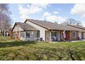 A cozy single story home with a screened in porch addition and well manicured backyard at 7349 Castleton Farms N Dr, Indianapolis, IN 46256