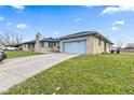 Charming single-story home features a stone exterior, covered front porch and attached garage on a sunny lot at 791 S Us Highway 31, Whiteland, IN 46184