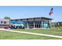 Inviting outdoor area with blue umbrellas and seating, perfect for enjoying a meal in the community at 8194 Bostic Ct, Fishers, IN 46038