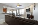 Relaxing living room with plush seating, fireplace and TV at 9694 Angelica Dr, Noblesville, IN 46060