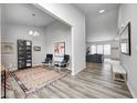 View of an open-concept living area with modern décor, light-colored flooring, and grey walls at 11598 Platt St, Noblesville, IN 46060
