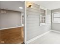 Neutral toned entryway featuring hardwood floors and large window at 1241 Brandt Dr, Indianapolis, IN 46241